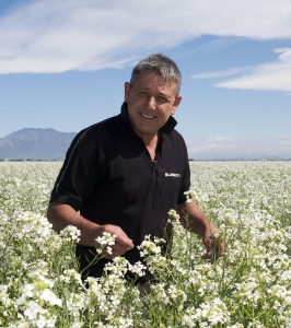 Jack Harnett stands in a field